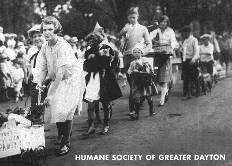 Historical photo of pets in a parade