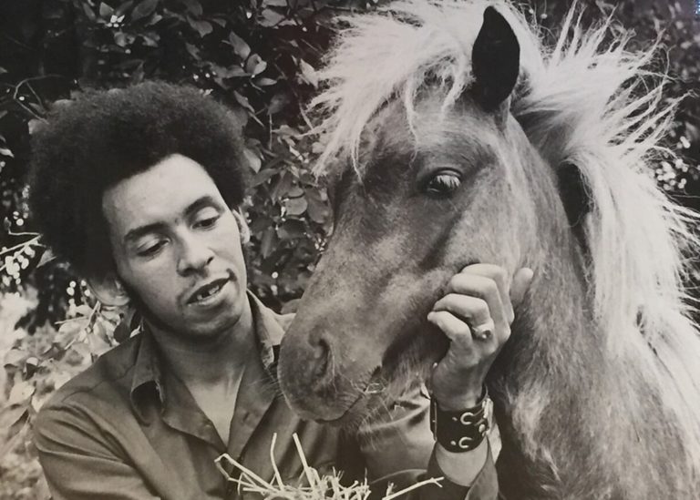 Historical photo of a man with a horse